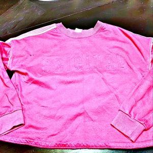 A long sleeved slightly cropped shirt.